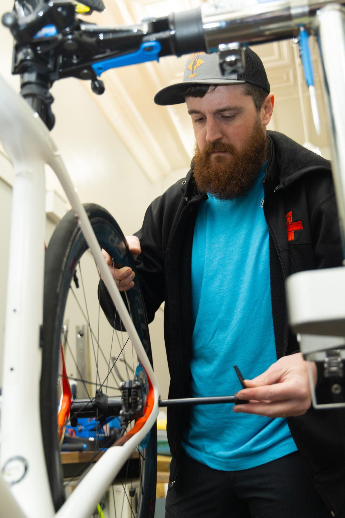 John Berry works on a bicycle in his Madison, S.D. business