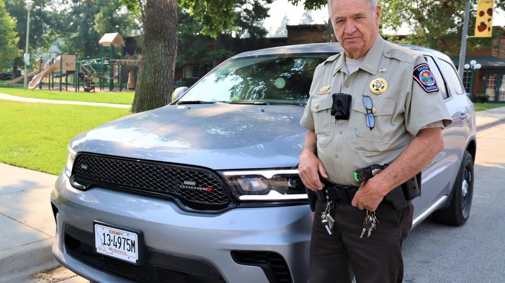 Marshal Larry Rose with one of the new police vehicles 