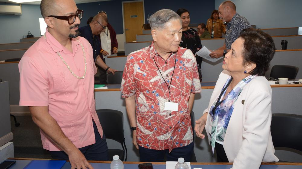 Rural Housing Service (RHS) Administrator Joaquin Altoro and Hawaii/Western Pacific State Director Chris Kanazawa speaks with Guam's Governor Lou Leon Guerrero following the outreach event held at the University of Guam. 