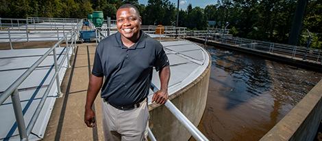 Man by water treatment plant