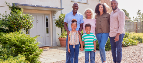 Family in front of home