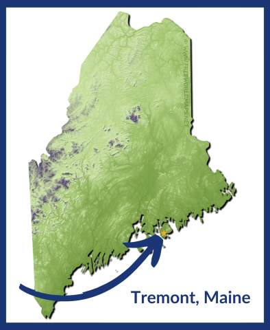A map of Maine features a blue arrow pointing to the location of the town of Tremont in Mount Desert Island about two thirds up the Maine coast.