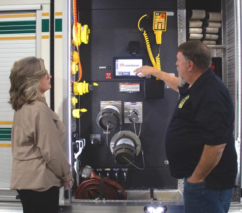 Deputy Chief Hayes demonstrates SAM features to RD Area Specialist Peggy Jordan. 