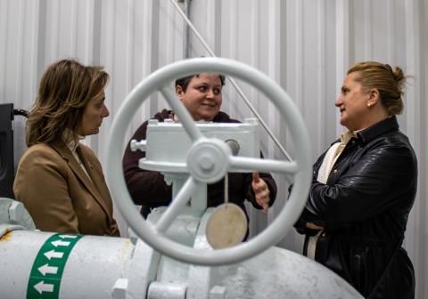 National Park Clerk (center) Joy Gunn talks with USDA staff during a visit to the borough's water facility which was aided by a $1M Rural Development Grant.
