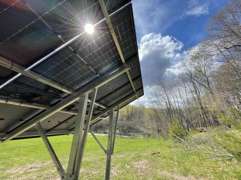 The sun shines through a recently installed solar array in rural Marion, Wisconsin.