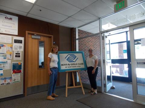 JeunElle Jefferies and Molly Najarro stand at entrance of Boys and Girls Club community center in Brigham City, Utah.