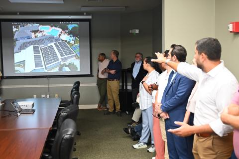 The Next Solar Energy Technology Inc.'s CEO, Roger Timoteo explaining the large-scale energy efficiency and renewable energy upgrades at The Pelican Athletic Club.