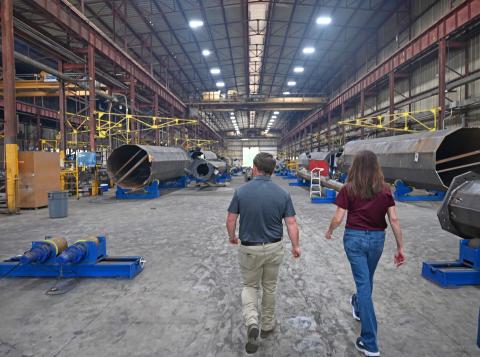 USDA Business and Cooperative Services Administrator Betsy Londrigan tours Southland Steel Fabricators facility with Engineer Zach.