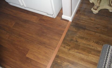 wooden floor and seam with a laminate floor