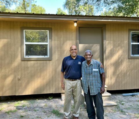 Brian Lewis, Branch Chief of the Office of the Single-Family Housing Guaranteed Loan Program and homeowner Joe Lewis.
