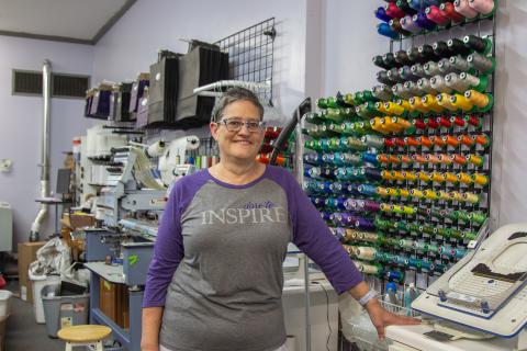 Ledford poses with some of the equipment used in her business
