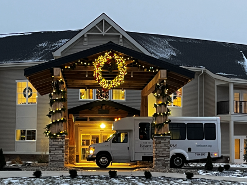 Festively lit entrance to an apartment building.