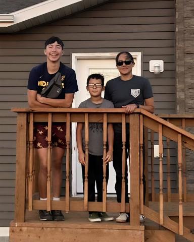 Ashley's family outside her home.