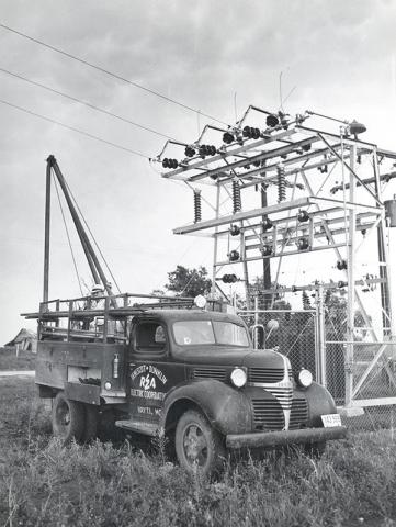 photo of old electric truck and power lines