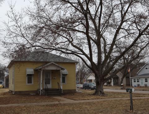 Picture of a yellow house in rural Nebraska