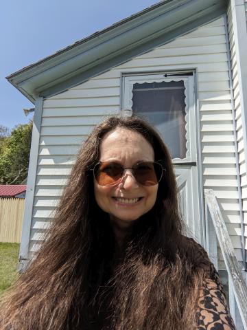 Tricia-Anne C in front of her front door