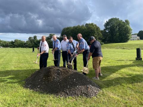 Members of the Corinna Fire Department break ground for the new fire station in July 2023.