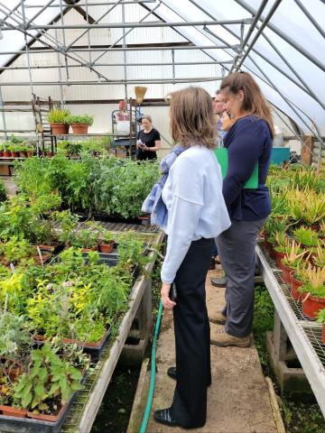 State Director Jane Asselta touring greenhouse at Oak Grove Plantation