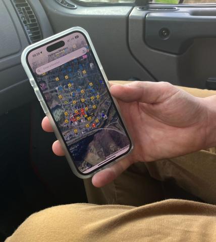 Lawson accesses the phone app to check hydrant locations