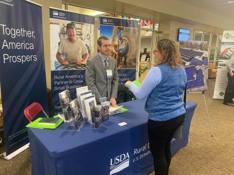 Dethon Kistler speaks with a potential borrower at the Industrial Development Forum this week at Susquehanna University.
