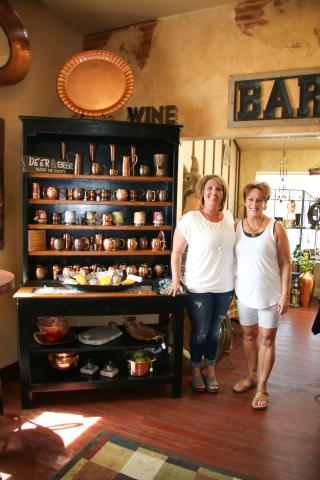 Owners Machelle LeProwse and Millie Rigby proudly highlighting some of the copper items sold in the store.