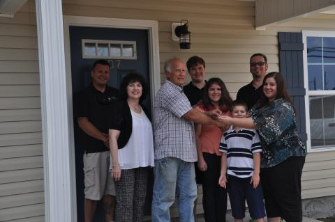 Aimee and family receive the keys to their newly constructed  Energy Star Certified home on June 13, 2016. 