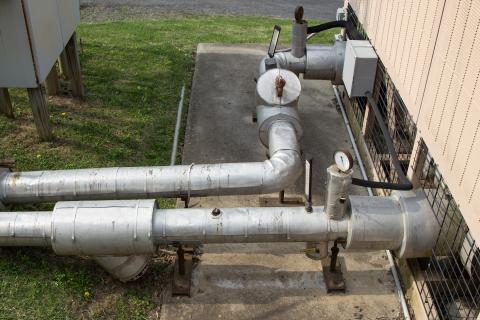 Close up view of pipes on chiller set to be replaced