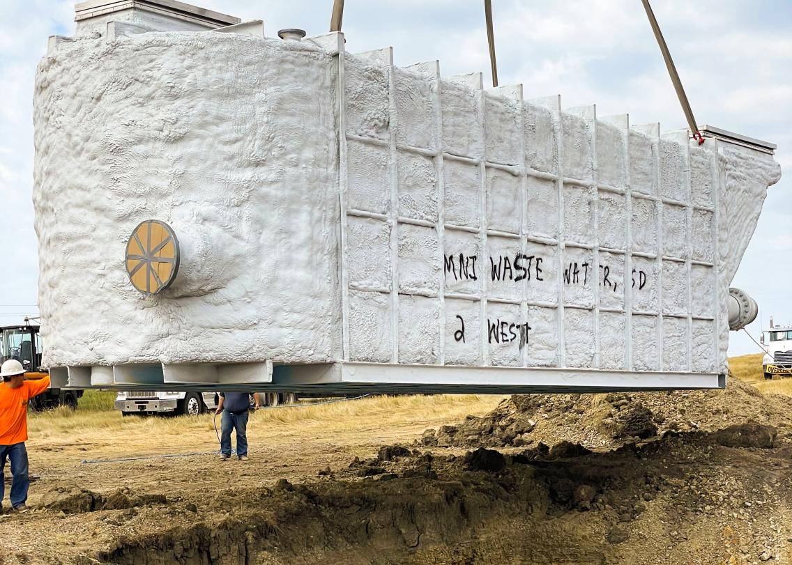 A Mni Waste Water Company crew installs equipment on the Cheyenne River Reservation