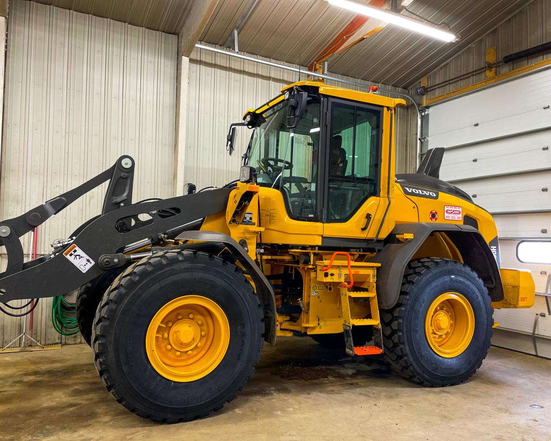 Payloader inside storage building.