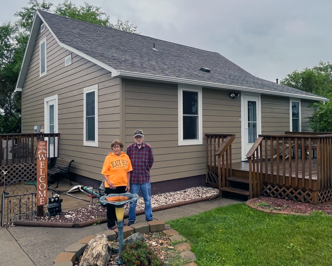 Bob and Mary Ann Volk outside their remodeled home in Herreid, SD.