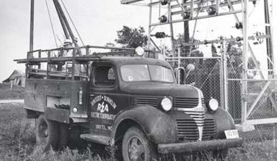 Black and white image of an old electric truck from the 1930s