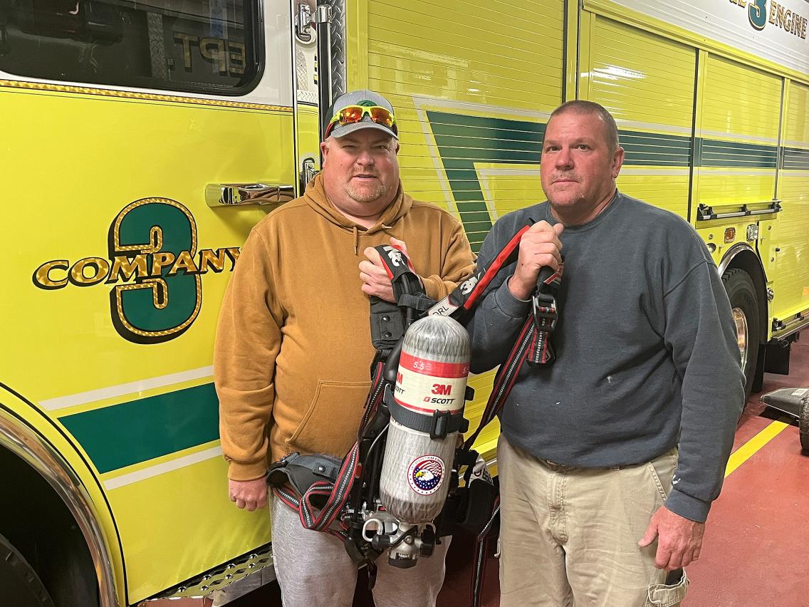 Chief Padgett and Assistant Chief Donald King pose with an air pack