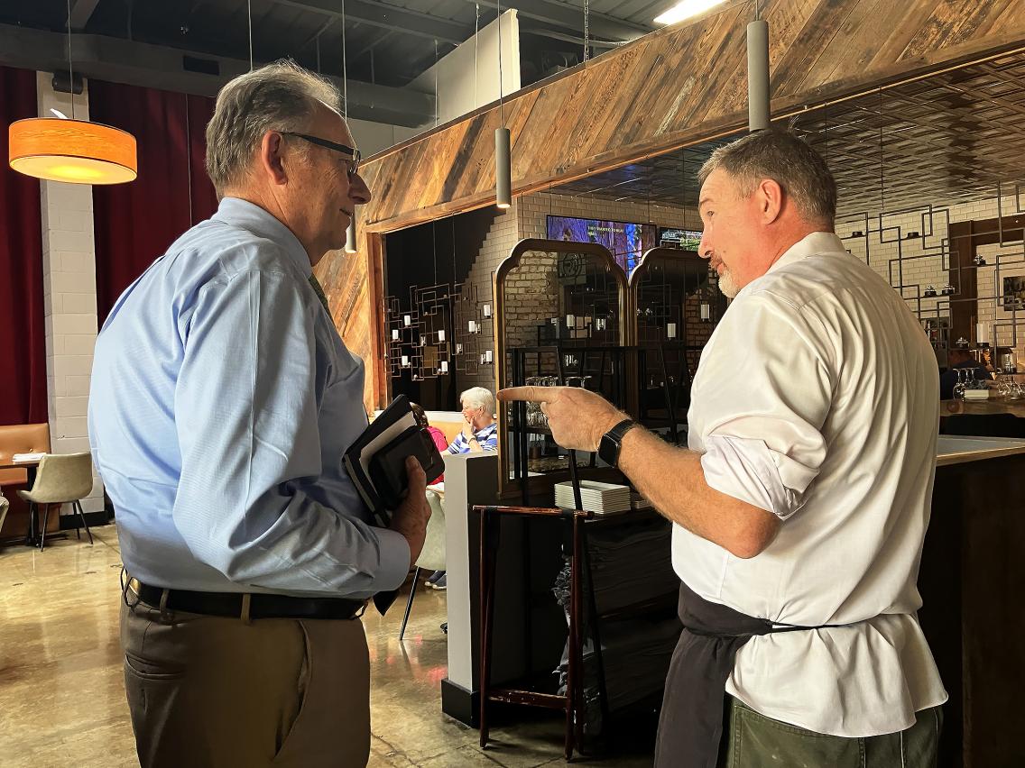 Hitchin and Krupa confer in the Heritage on Main Street dining area