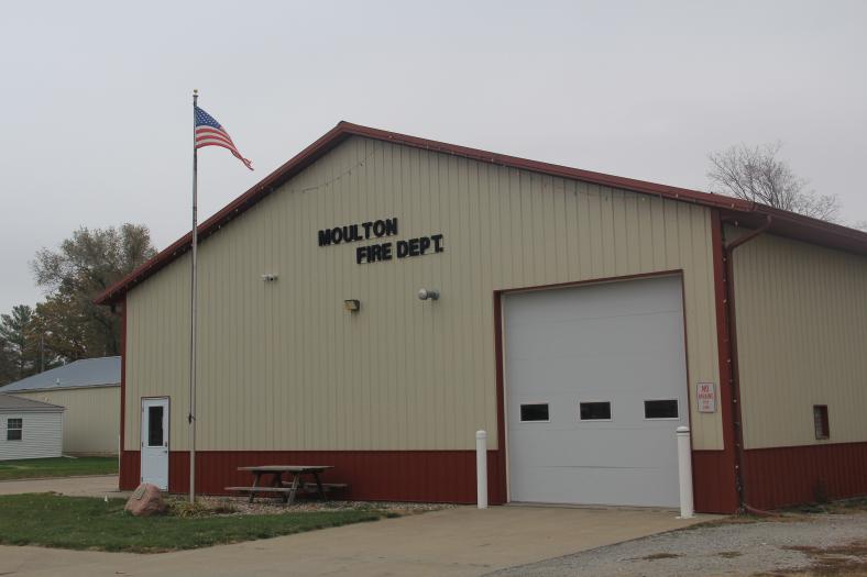 The US flag flies in the breeze outside the Moulton, Iowa, volunteer fire department station.