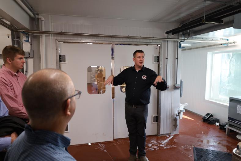 Redhead Creamery Co-Founder Lucas Sjostrom leads a tour of the cheesemaking and distilling expansion. 