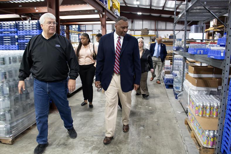 Director of State Operations Basil Gooden tours the Virginia Artesian Bottling Company with owner Steve Brown