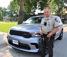 Marshal Larry Rose with one of the new police vehicles