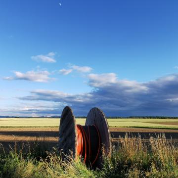 Reel of Fiber in rural countryside.