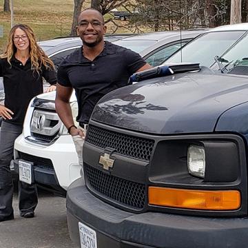 Harvest Outreach Center staff pose with new vehicles purchased with Emergency Rural Healthcare Grant funding.
