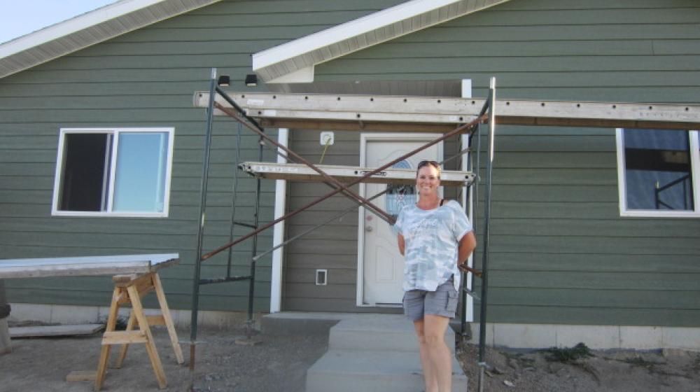 Lori Bonifay in front of her home