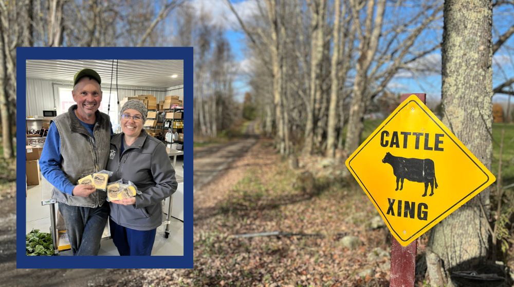 A photo of a man and a woman holding packages of cheese and smiling is inset against a photo of a long driveway bordered by trees and fields with a "cattle crossing" sign on the right side. 