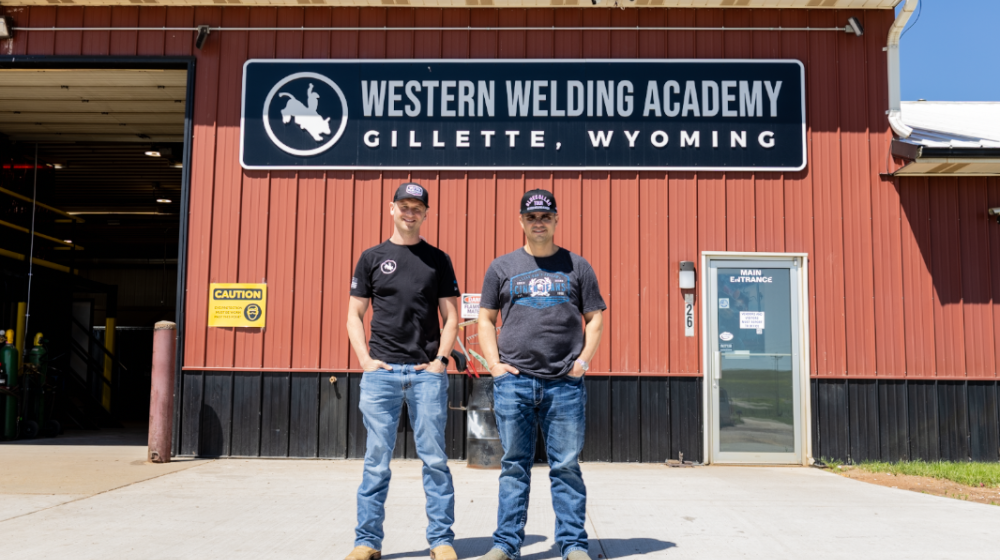 Beau Barkley, Director of Creative & Brand Partnerships, and Tyler Sasse, Founder & Owner of Western Welding Academy, stand in front of the elite welding school that recruits students from around the country.