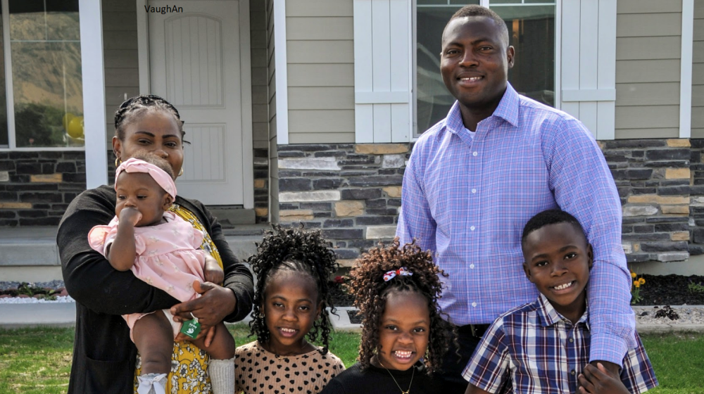 Francis & Nicole Badibanga in front of their new home with their four children