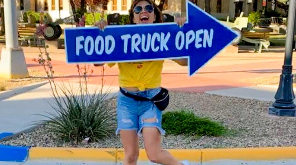 Lovington Mainstreet Executive Director Mara Salcido directs customers to the ‘Local Innovators Institute’ food truck called “Big Blue”
