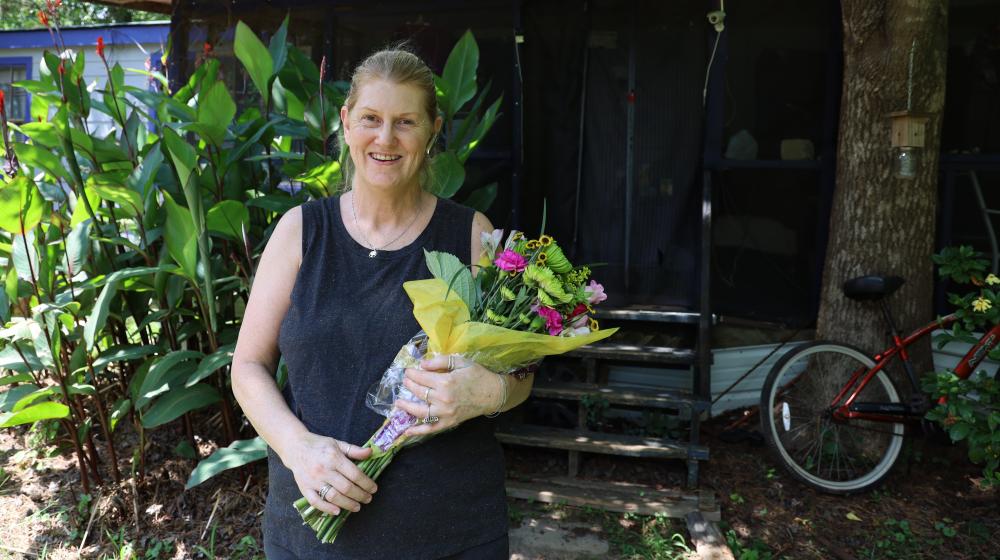 Ms. Cynthia Veal holding flowers 