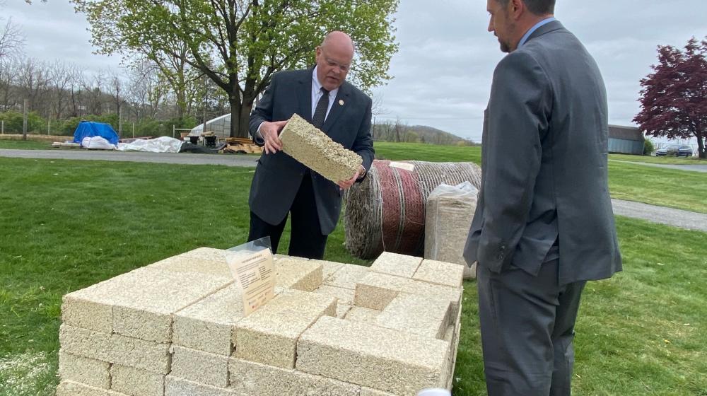 State Director for Rural Development in Pennsylvania inspects a Hemp Block at Alvernia University.