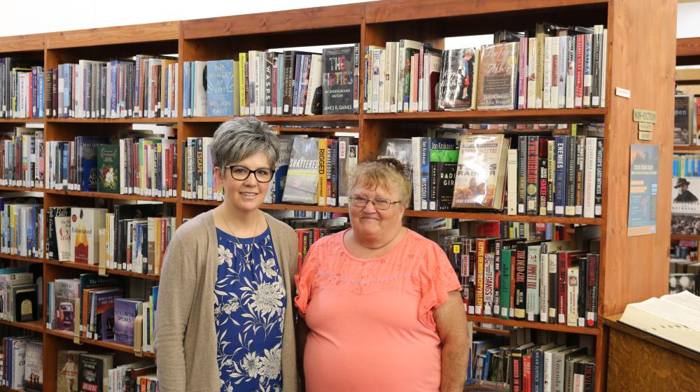Librarians present and past, Tina Peterson (L) and Kathleen Schreiber (R) in Harlowton's Library. 
