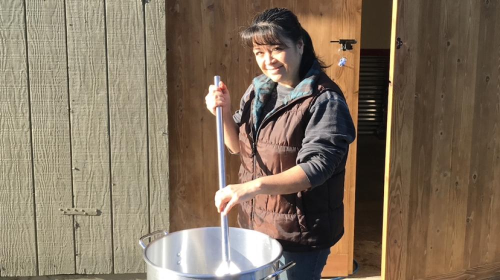 Owner of Fable Farms preparing wine