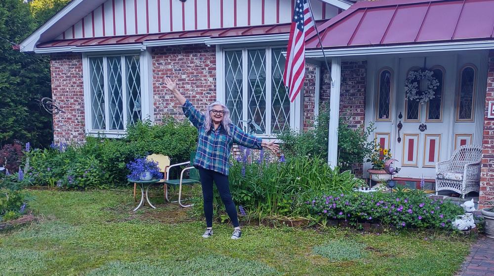 Joyce Caldwell outside her new home