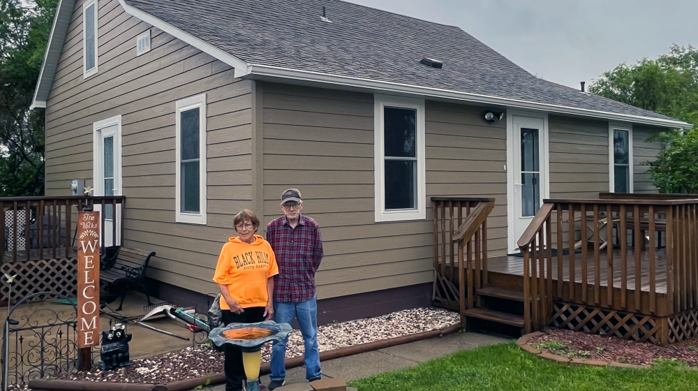 Bob and Mary Ann Volk outside their remodeled home in Herreid, SD.